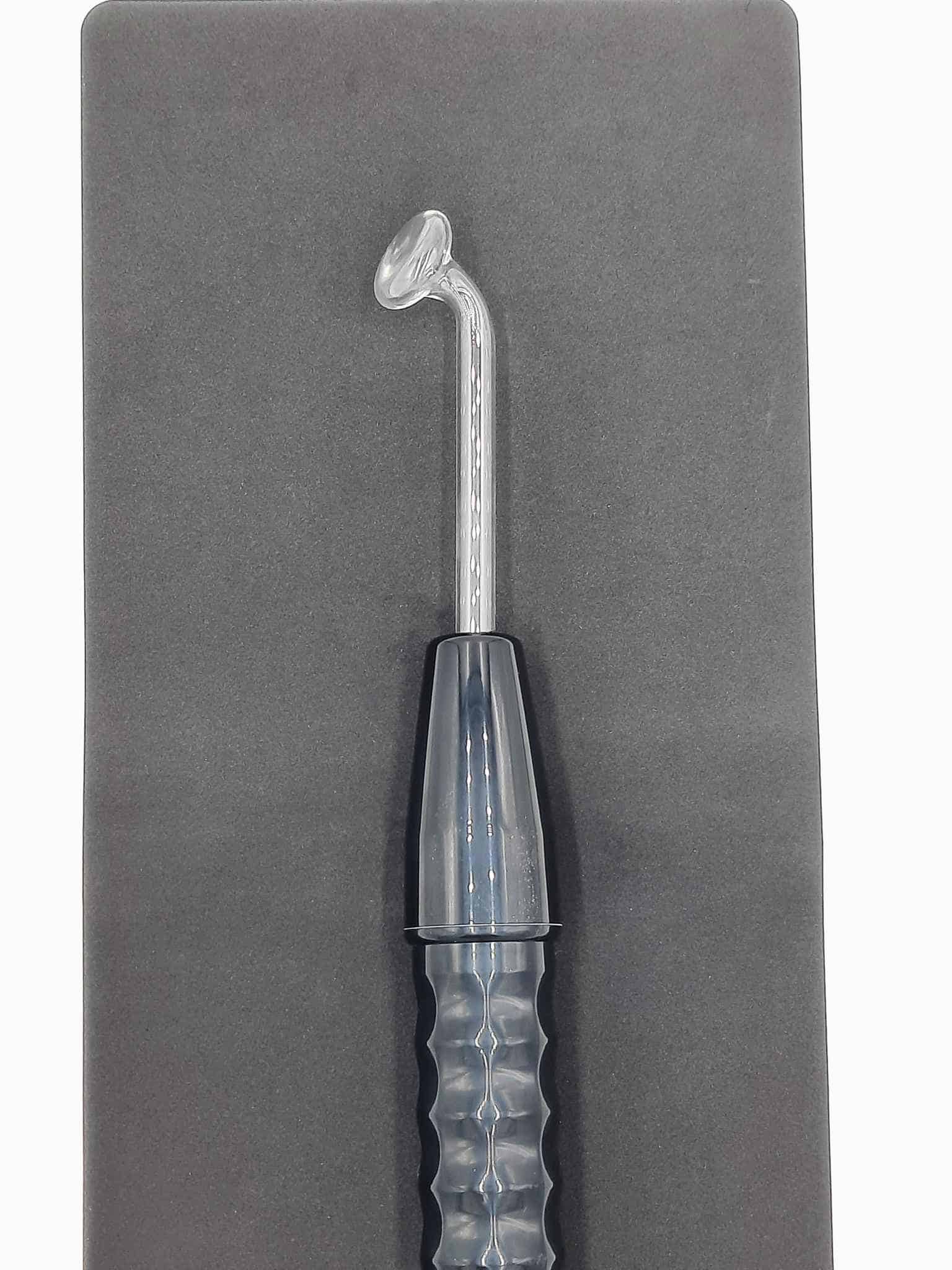 Glass round attachment inside a violet wand