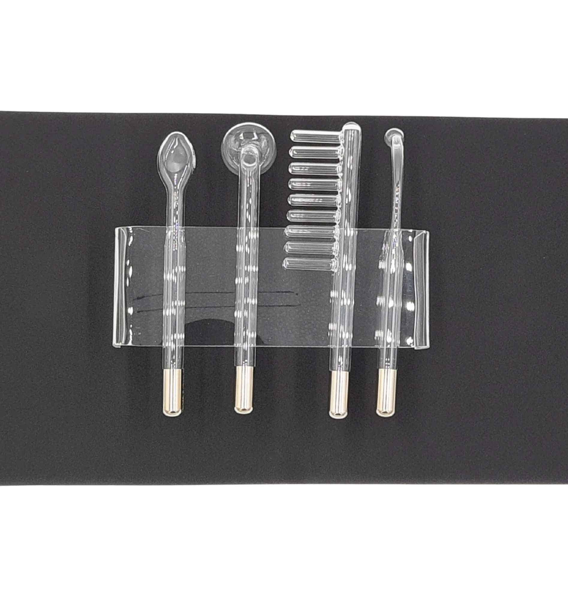 Glass accessories that plug into Violet Wand on black background